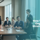 Diverse luxury hotel and high-end retail professionals participating in a workplace English training session, collaborating with a trainer in a modern conference room to strengthen communication, teamwork, and employee development.